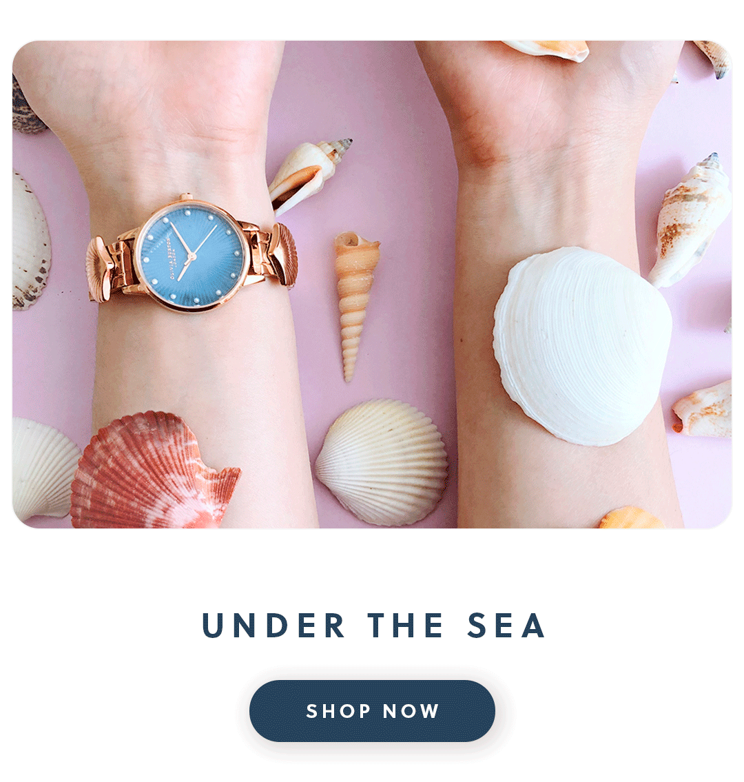 An Olivia Burton watch surrounded by sea shells with text under the sea shop now