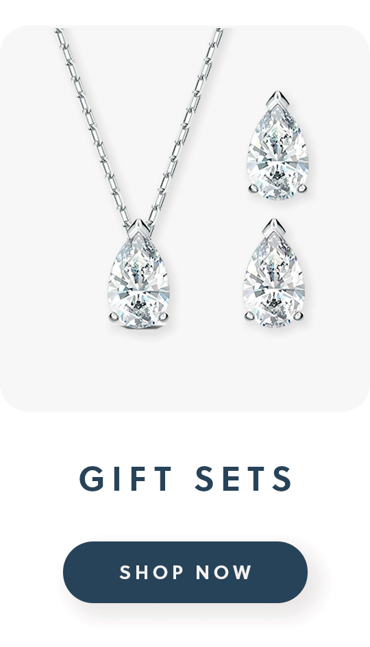 A pair of Swarovski earrings and a matching necklace with text gift sets shop now