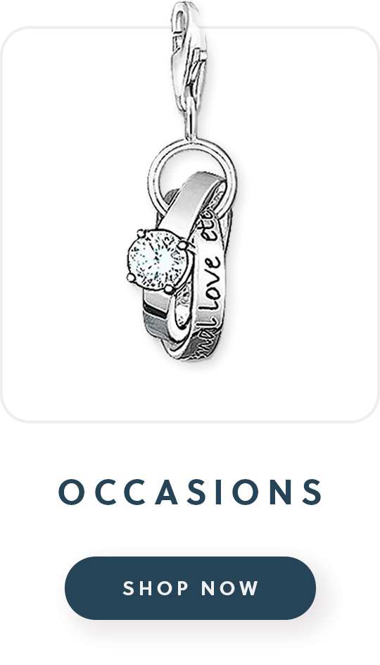 A thomas sabo charm with two rings with text occasions shop now