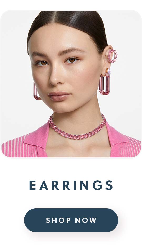 A woman wearing a pair of Swarovski earrings with text earrings shop now